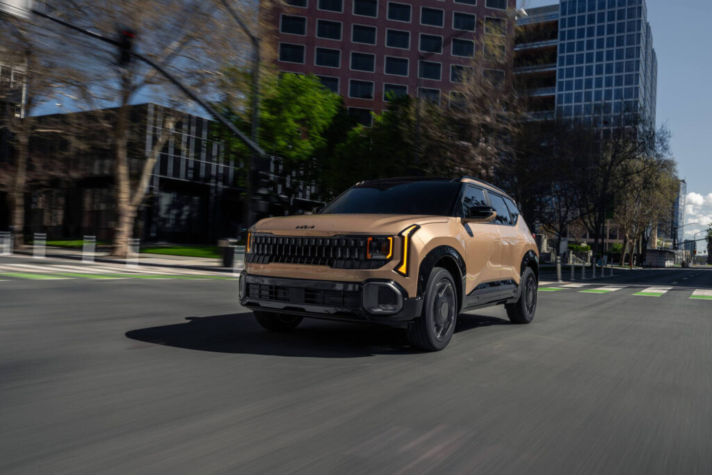 2027 Kia Seltos X-Line in bronze on a city street