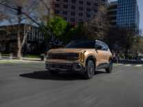 2027 Kia Seltos X-Line in bronze on a city street