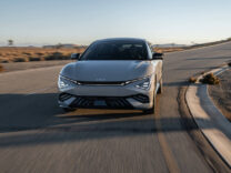 2027 Kia EV6 head-on at speed on a desert road