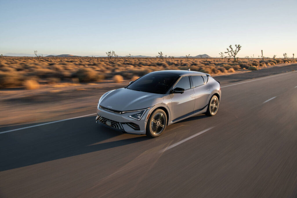 2027 Kia EV6 driving on a desert highway