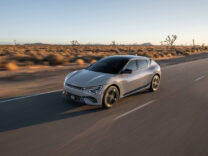 2027 Kia EV6 driving on a desert highway