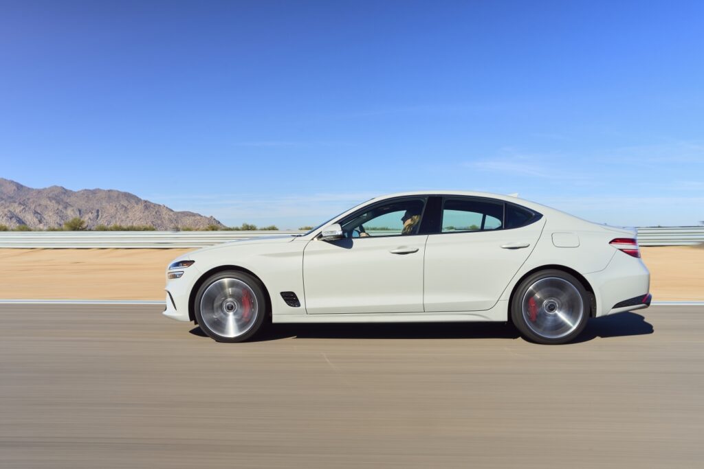 Genesis G70 in white on a desert test track
