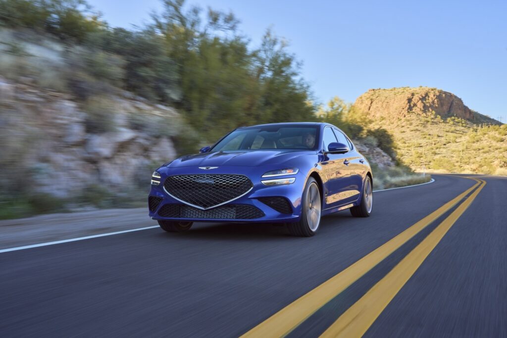 Genesis G70 in blue on a desert road