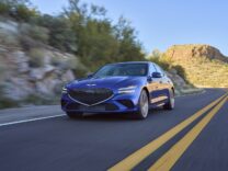Genesis G70 in blue on a desert road