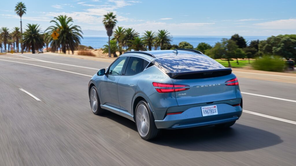 2026 Genesis GV60 driving along a coastal road