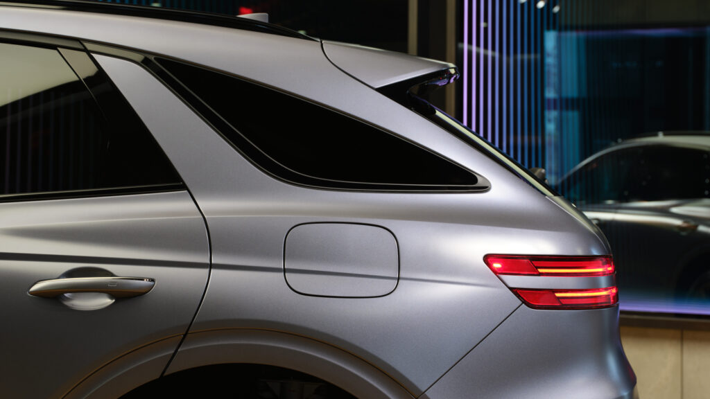 2027 Genesis GV70 Prestige Graphite rear quarter in matte paint